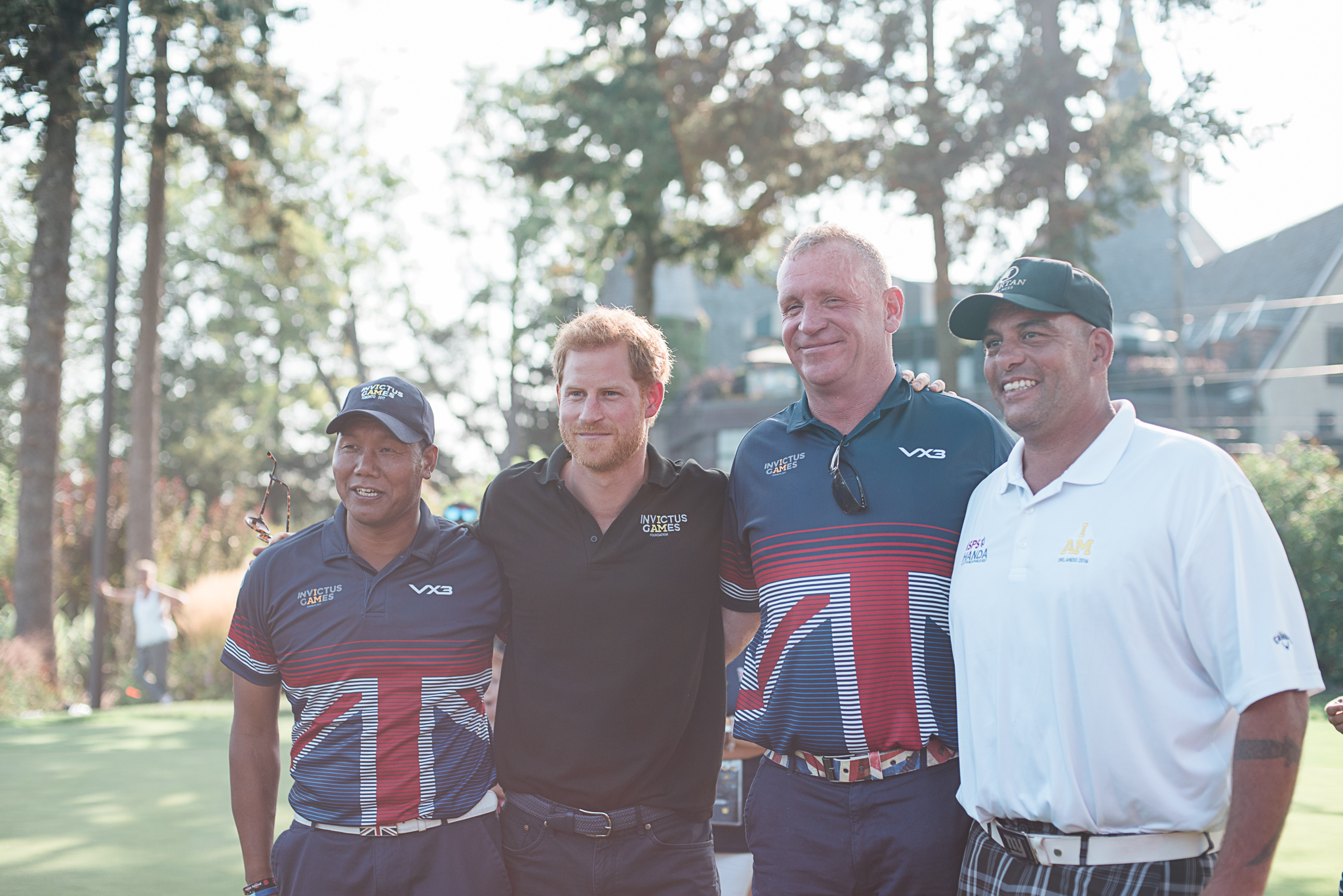 Prince Harry poses with members of the UK's Invictus Golf Team.